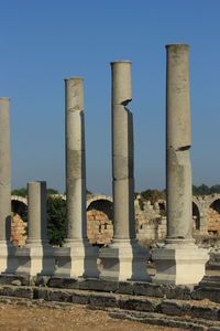 Ruins of historical building against blue sky