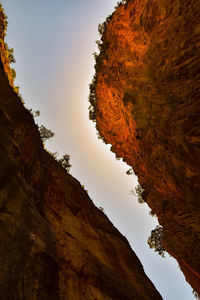 Low angle view of rock formation against sky during sunset