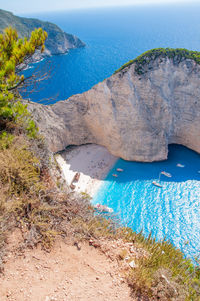 High angle view of rocks on sea shore