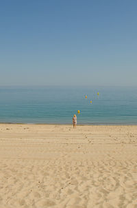 Woman standing on beach