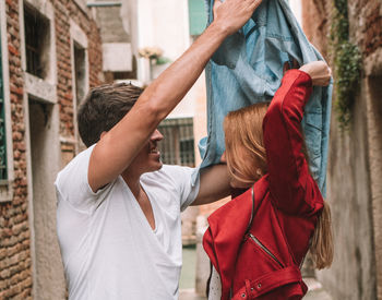 Full length of father with daughter standing outdoors