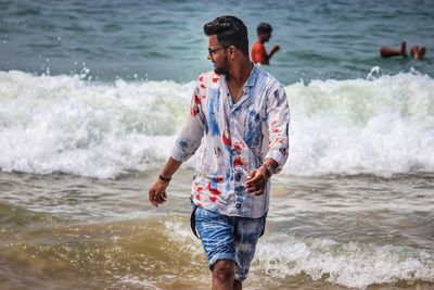 Full length of man standing at beach