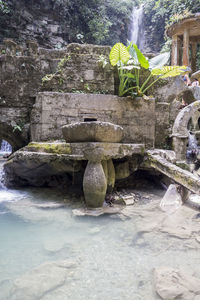 View of temple against rock formation