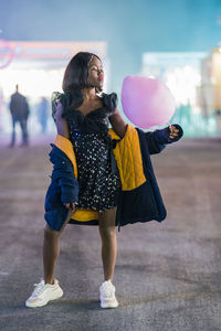 Cheerful african american woman with cotton candy