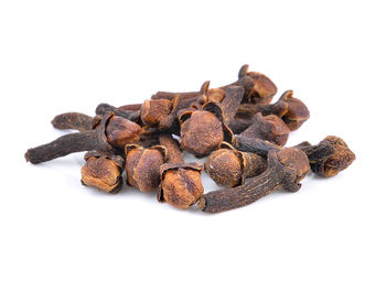 Close-up of coffee beans against white background