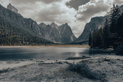 Scenic view of lake and mountains against sky