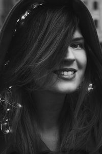 Close up smiling lady with fairy lights in hair monochrome portrait picture