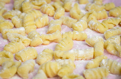 High angle close-up of gnocchi on cutting board