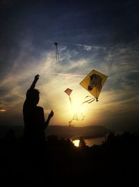 Silhouette of people at sunset