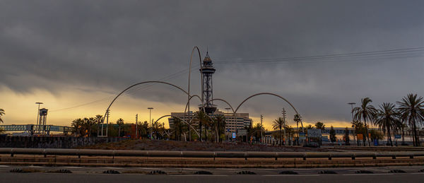 Palm trees against sky during sunset