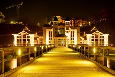 Night seabridge restaurant in sellin, ruegen island, germany. house on pilons in baltic sea