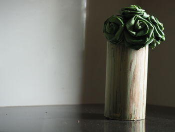 Close-up of rose on table