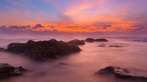 Clouds over rocks during sunrise