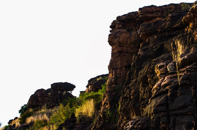 Low angle view of rock formation against clear sky