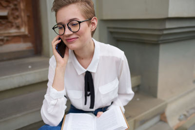 Young woman using mobile phone