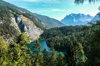 Scenic view of lake and mountains against sky