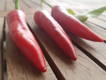Close-up of red chili peppers on table