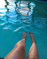 Low section of woman in swimming pool