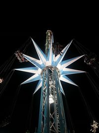 Low angle view of illuminated ferris wheel