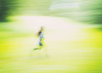 Blurred motion of man in water