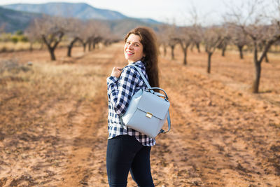 Woman standing on field