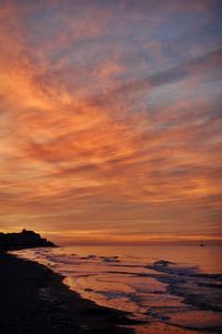 Scenic view of sea against sky at sunset