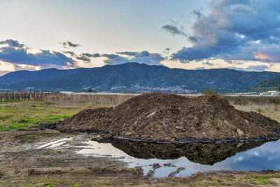 Scenic view of landscape and mountains against sky