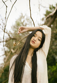 Chinese teenager with a flower in hand v