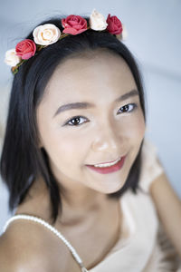 Close-up portrait of a smiling young woman