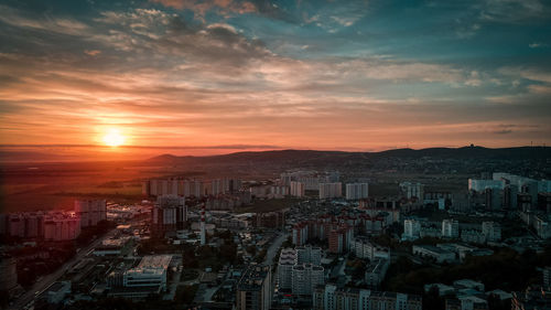 High angle view of buildings against sky during sunset