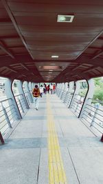 People walking on bridge