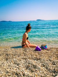 Full length of woman on beach against sky