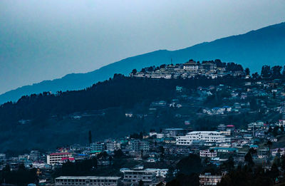 High angle view of illuminated buildings in city