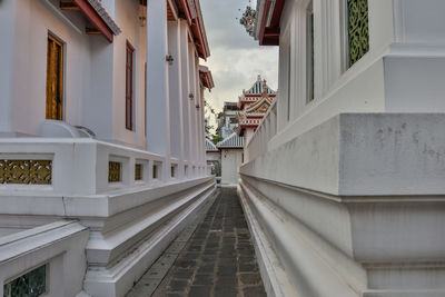 Staircase amidst buildings in city