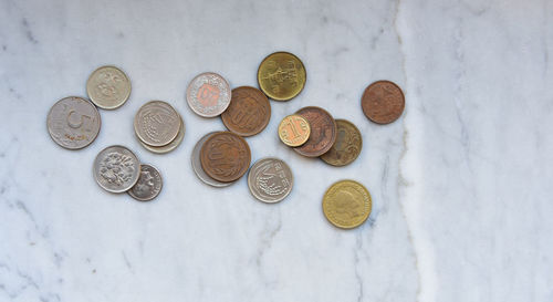 High angle view of coins on table