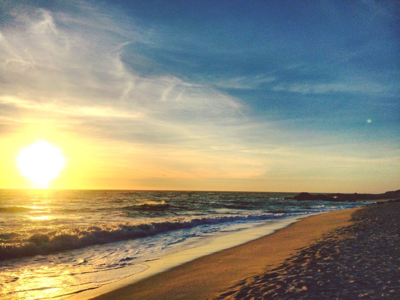 beach, sea, horizon over water, sunset, water, beauty in nature, sand, sky, nature, sun, scenics, no people, sunbeam, tranquility, outdoors, tranquil scene, cloud - sky, day