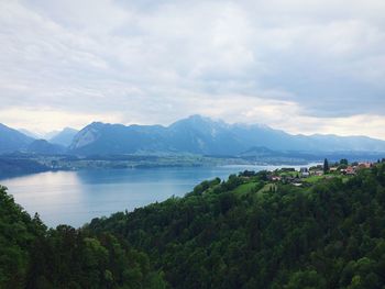 Scenic view of mountains against cloudy sky