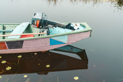 Boat moored on lake