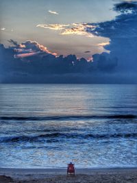 Scenic view of sea against cloudy sky