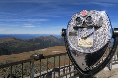 Close-up of coin-operated binoculars on mountain