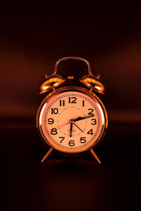 Close-up of clock on table