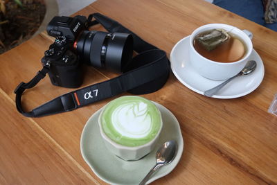 High angle view of coffee served on table