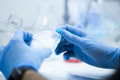 Cropped hand of doctor examining patient at clinic