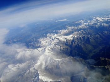 Aerial view of mountains against sky