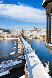 High angle view of river and cityscape against sky