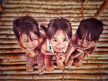 Portrait of smiling girl on wood