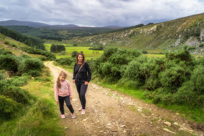 Family hiking in lough dan, wicklow mountains, ireland