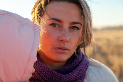 Close up portrait of beauty autumn woman in frosty stylish coat with little baby 