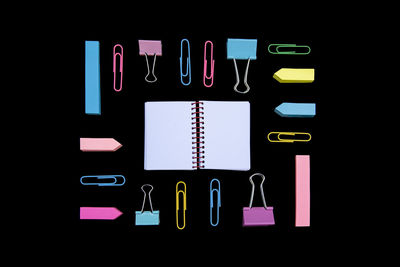 Close-up of multi colored pencils against black background