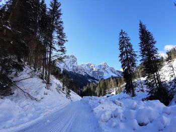 Scenic view of snow covered mountains against sky